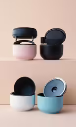 three colored bowls sitting on top of a shelf