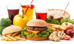 a burger with lettuce, cheese, tomato, lettuce, apples and other foods
