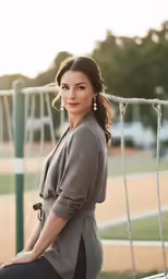 a pregnant woman is posing for her picture