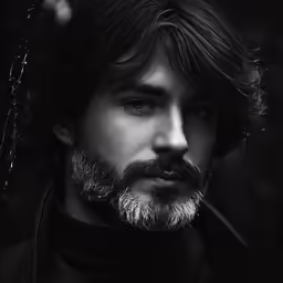 the bearded man has his head tilted