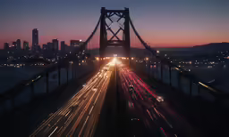 a freeway with traffic going over it that has buildings in the background