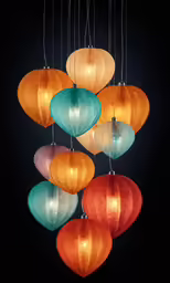 eight colorful lanterns hanging from a chandelier