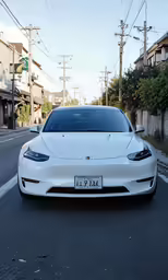 a white car parked on the side of the street