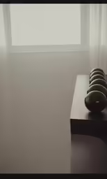 some rocks on top of a shelf in a room