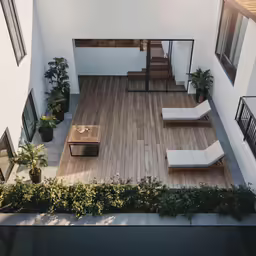 an open room with white walls and wooden floors