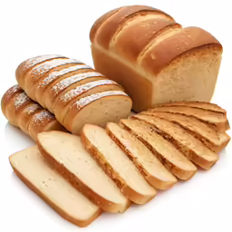 a bunch of bread and slices on a white surface