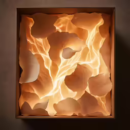 a close up of a box with a paper design on it