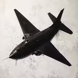 an airplane flies in the sky over the ground