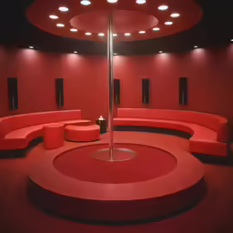 a room with red couches and lamps