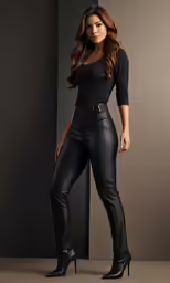 a woman wearing a black leather pants and heels