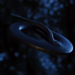 a black and white snake sitting on the edge of a tree branch