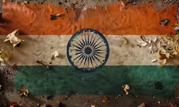a large orange and green flag on a concrete surface