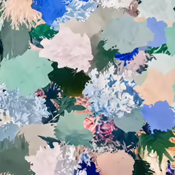 close up of colorfully colored paintbrushes in a textured pattern