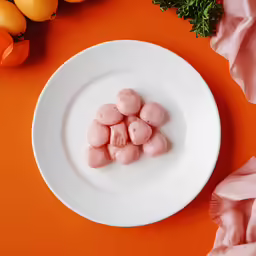 a white plate with some fruit on it