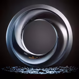 a white circular object on a black surface