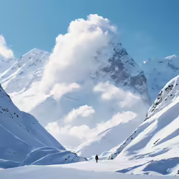 a mountain range with snow and some people