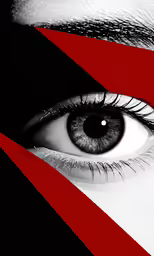 the eye of a person is with a red and black background