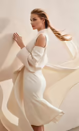 a woman with long hair in a white dress