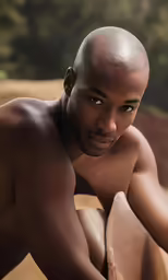 black man leaning on rock with a bushy hair