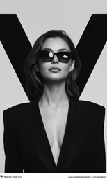a woman with sunglasses posing for the camera