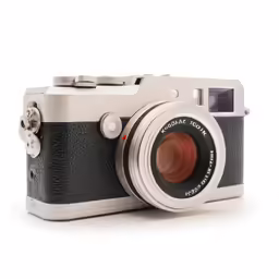 an old - fashioned camera is shown with the lens pointed out