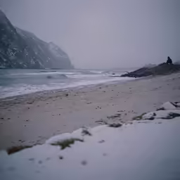 two people on the beach during winter time