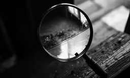 a magnifying glass sitting on top of a table