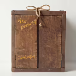 a box with writing on it that is tied to the front