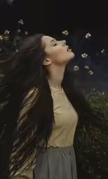 a woman with long hair and flowers on her nose