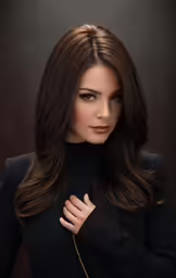 a woman wearing a black jacket is posing for a photo