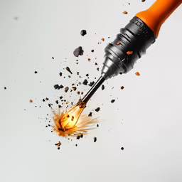 an orange drill being used to repair a fire on the ground