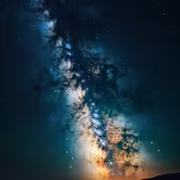 there is a light trail on a starr filled sky