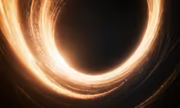 a light is spinning in a ring on black