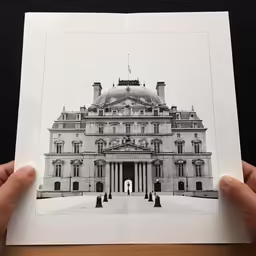 a large white building with an arched doorway on top