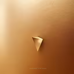 an artistic gold background with two dimensional shapes