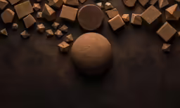 a black background with brown and white shapes on it