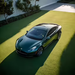 an electric sports car sits on grass in front of a house