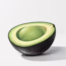 a half of an avocado in the middle of its peel