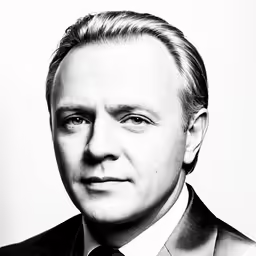 a man wearing a suit and tie