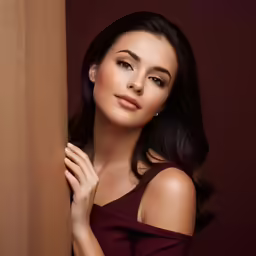 the beautiful woman poses for a studio portrait