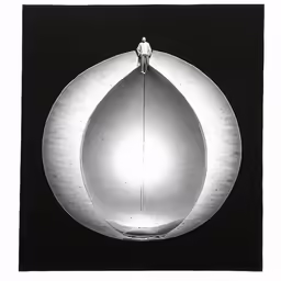 a person is standing on top of a round object