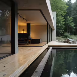 a very nice looking pool area with a table next to it