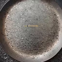 the wok has steam on the surface of the pan