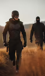 two men wearing ski masks and carrying skis in field
