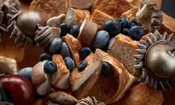 an assortment of foods that are covered in blueberries