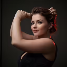 a woman posing with her arm around her head