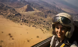 a person in an airplane with some goggles on