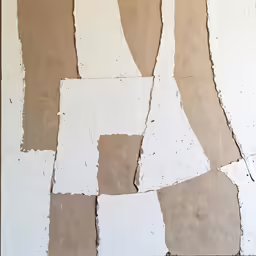 several pieces of white paint are on the wall