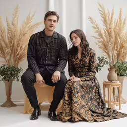 there is a man and woman sitting on a bench
