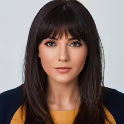 a close up image of a woman with long hair